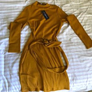 Brown short tight belted dress.